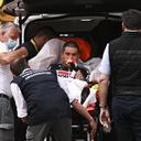 Australia's Caleb Ewan is carried into an ambulance after crashing in the sprint towards the finish line of the third stage of the Tour de France cycling race over 182.9 kilometers (113.65 miles) with start in Lorient and finish in Pontivy, France, Monday, June 28, 2021. (Anne-Christine Poujoulat/Pool Photo via AP)