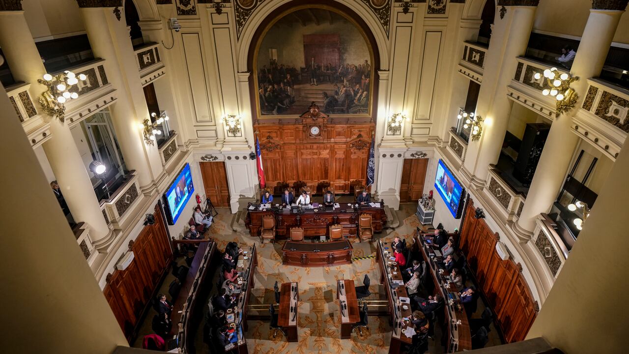 Constitutional experts, who are not lawmakers, hold a last meeting inside the National Congress to create a proposal to send to members of the Constitutional Council in Santiago, Chile, Monday, June 5, 2023. The Council Constitutional will start drafting a new national Constitution for Chile on June 7 and have five months to complete their task. (AP Photo/Esteban Felix)