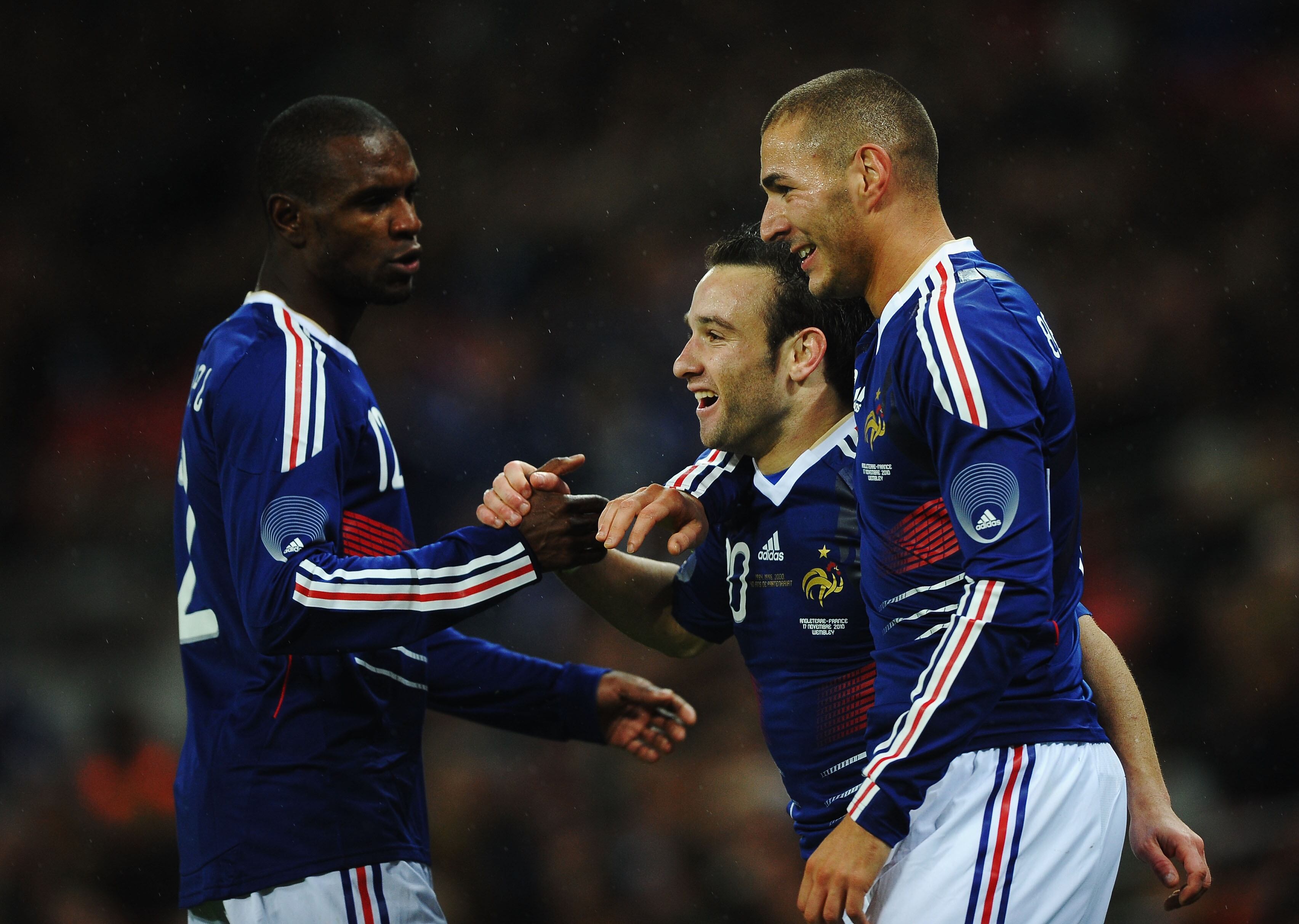 LONDON, ENGLAND - NOVEMBER 17: Mathieu Valbuena of France (C) celebrates with Eric Abidal (L) and Karim Benzema (R) as he scores their second goal during the international friendly match between England and France at Wembley Stadium on November 17, 2010 in London, England. (Photo by Laurence Griffiths/Getty Images)