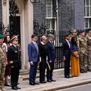 Britain's Prime Minister Rishi Sunak and his wife Akshata Murty are joined outside 10 Downing Street by Ukrainian Ambassador to the UK, Vadym Prystaiko and his wife Inna, members of the Ukrainian Armed Forces and representatives from each Interflex nation, during a minute's silence to mark the one-year anniversary of the full-scale Russian invasion of Ukraine, in London, Friday, Feb. 24, 2023. (AP Photo/Alberto Pezzali)