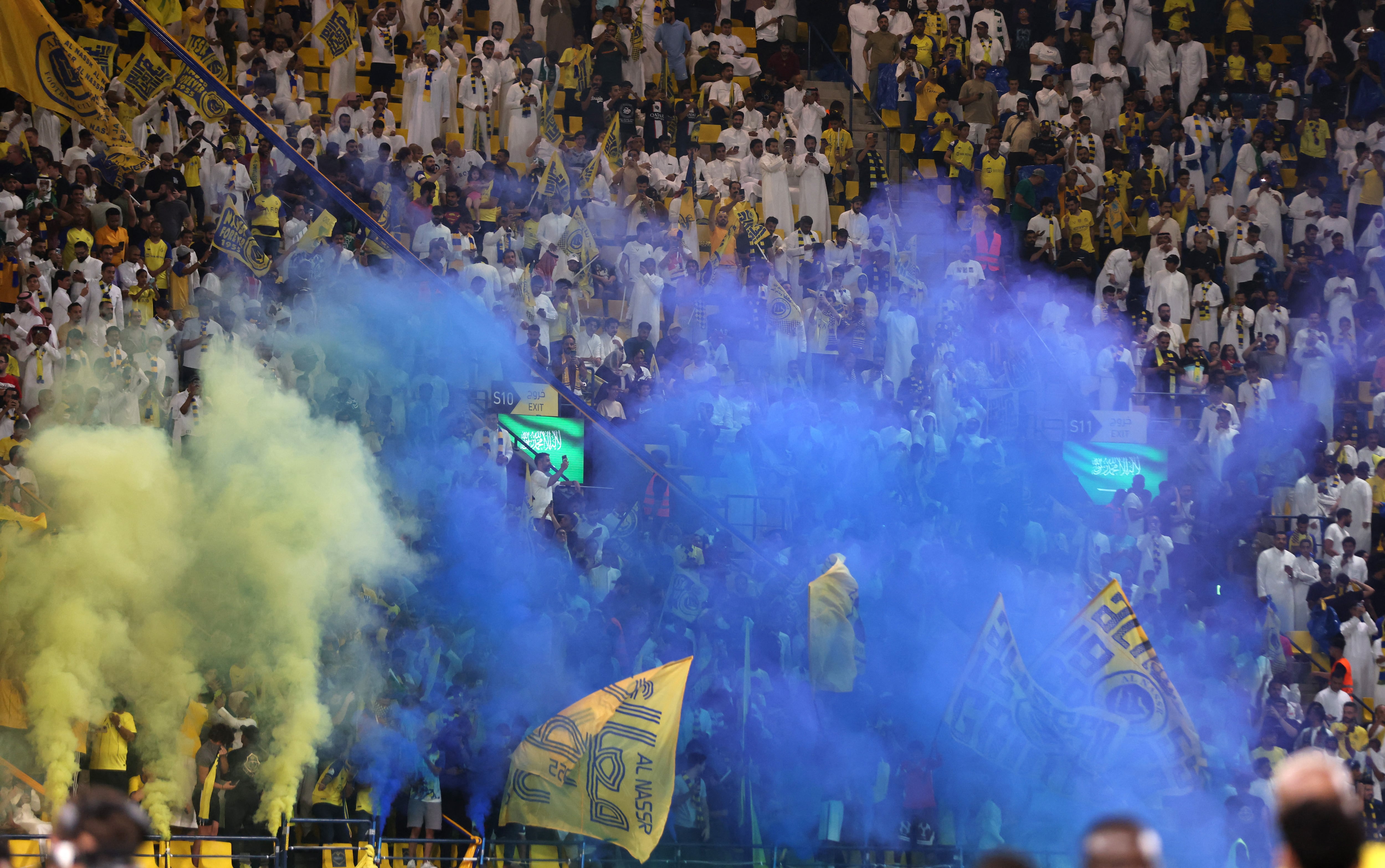 Soccer Football - Saudi Pro League - Al Nassr v Al Ahli - Al-Awwal Park, Riyadh, Saudi Arabia - September 22, 2023 Al Nassr fans with flares REUTERS/Ahmed Yosri