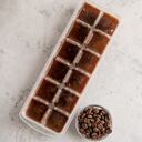 Cubes of frozen coffee in the form of ice with coffee beans. Cocktail ingredient.