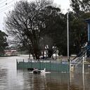 A general view shows a flooded residential area from the overflowing Hawkesbury river due to torrential rain in the Windsor suburb of Sydney on July 4, 2022. (Photo by SAEED KHAN / AFP)