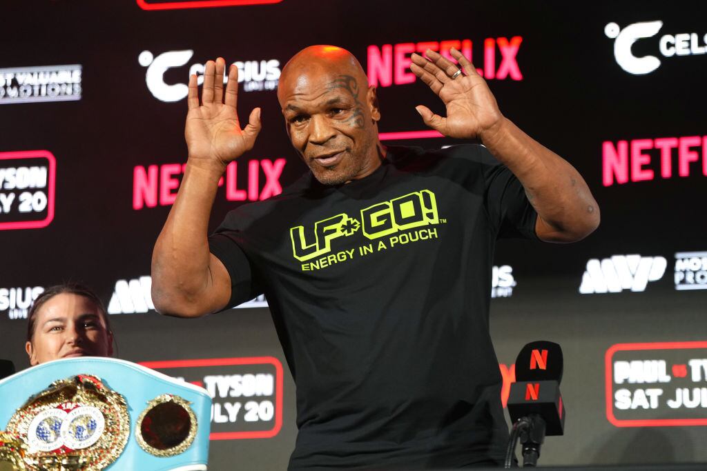 ARLINGTON, TEXAS - MAY 16: Mike Tyson speaks onstage during the Jake Paul vs. Mike Tyson Boxing match Arlington press conference at Texas Live! on May 16, 2024 in Arlington, Texas.  (Photo by Cooper Neill/Getty Images for Netflix)
