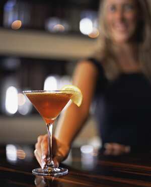 Woman serving martini