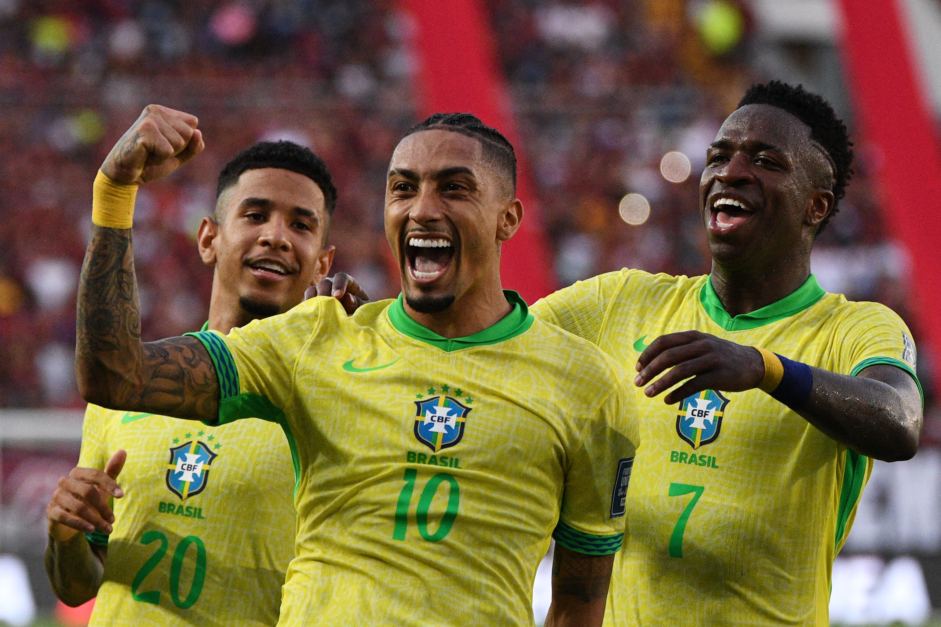Venezuela's midfielder #10 Telasco Segovia celebrates with teammate midfielder #13 Jose Martinez after scoring during the 2026 FIFA World Cup South American qualifiers football match between Venezuela and Brazil at the Monumental stadium in Maturin, Monagas State, Venezuela, on November 14, 2024. (Photo by Federico Parra / AFP)