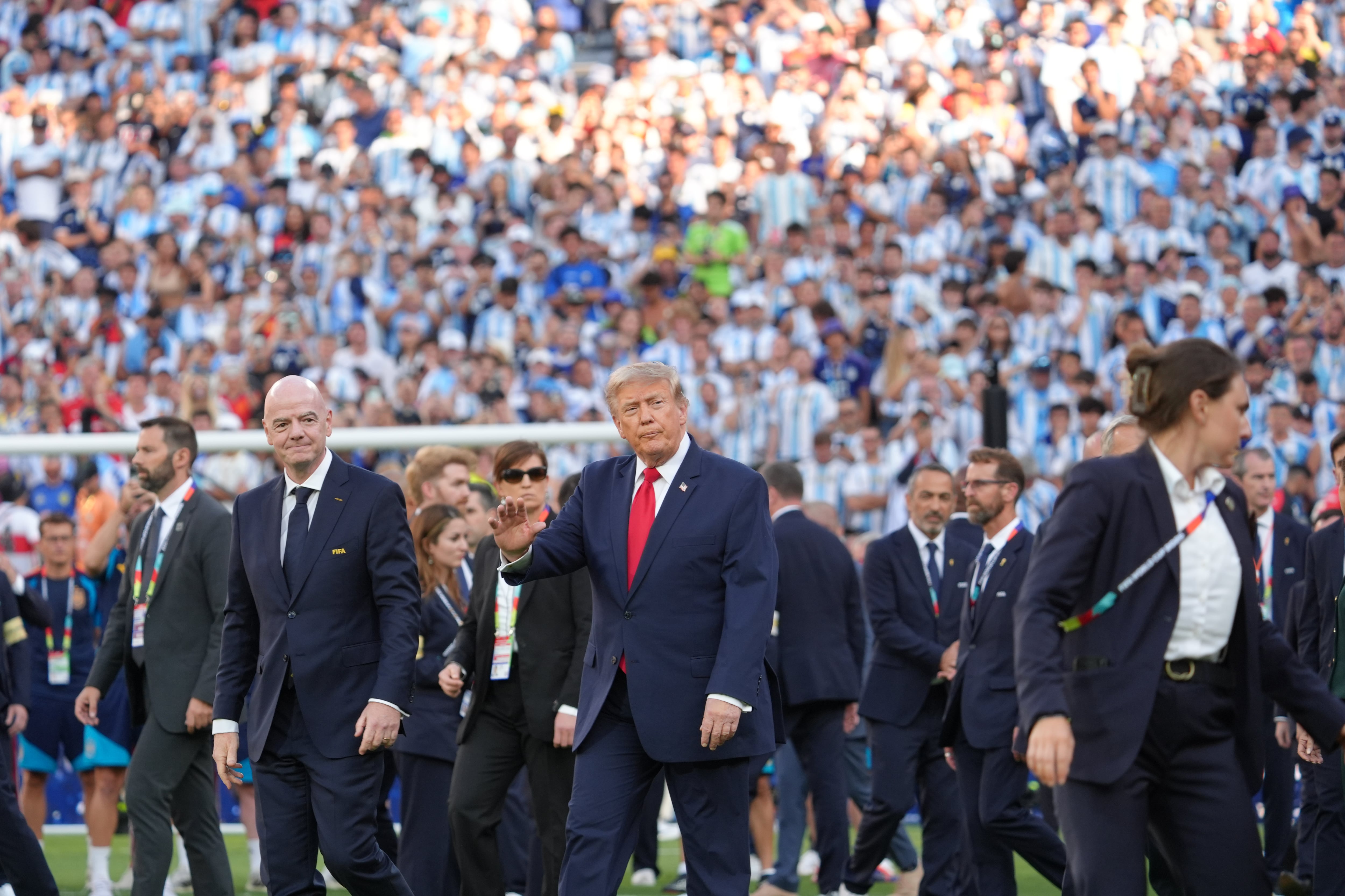 President Donald Trump, center right, walks alongside FIFA President Gianni Infantino at the conclusion of the World Cup championship final soccer match between Spain and Argentina in East Rutherford, N.J., Sunday, July 19, 2026. (AP Photo/Jacquelyn Martin)