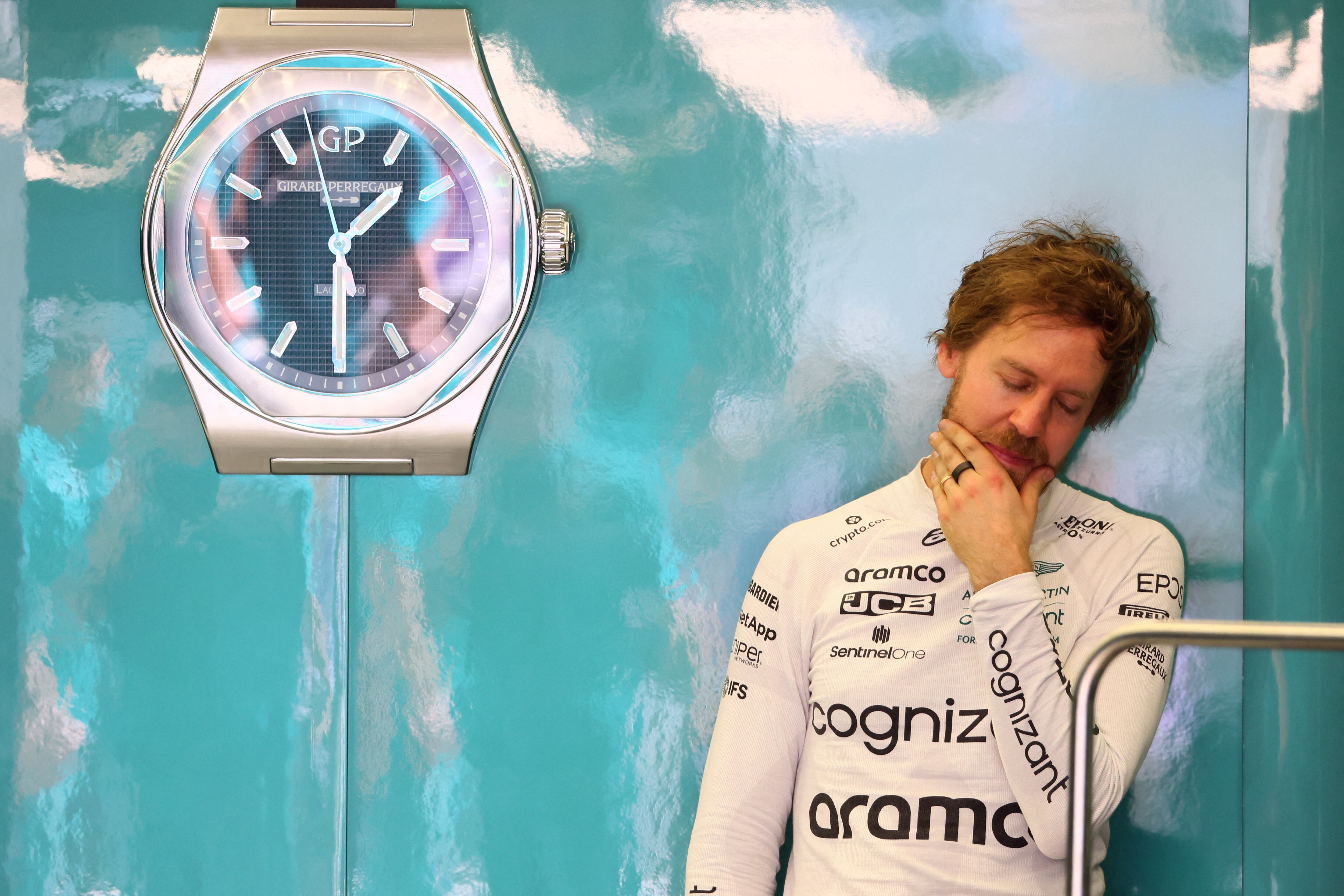 Aston Martin's German driver Sebastian Vettel reacts during the second day of Formula One (F1) pre-season testing at the Bahrain International Circuit in the city of Sakhir on March 11, 2022. (Photo by Giuseppe CACACE / AFP)