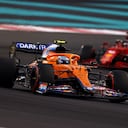 ABU DHABI, UNITED ARAB EMIRATES - DECEMBER 12: Lando Norris of Great Britain driving the (4) McLaren F1 Team MCL35M Mercedes leads Charles Leclerc of Monaco driving the (16) Scuderia Ferrari SF21 during the F1 Grand Prix of Abu Dhabi at Yas Marina Circuit on December 12, 2021 in Abu Dhabi, United Arab Emirates. (Photo by Clive Rose/Getty Images)