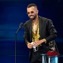 Mike Bahia accepts the award for best new artist at the 21st Latin Grammy Awards, airing on Thursday, Nov. 19, 2020, at American Airlines Arena in Miami. (AP Photo/Marta Lavandier)