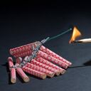 Fireworks lit with flame of match