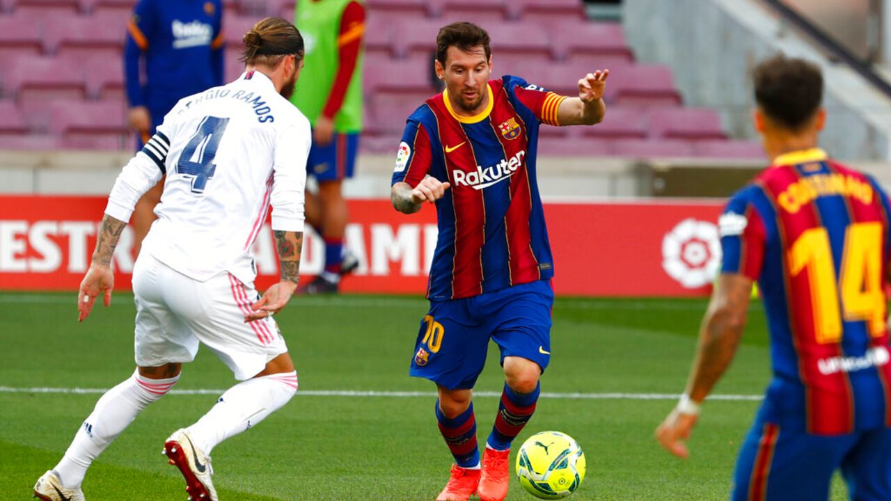 Jugadores del Barcelona y Real Madrid