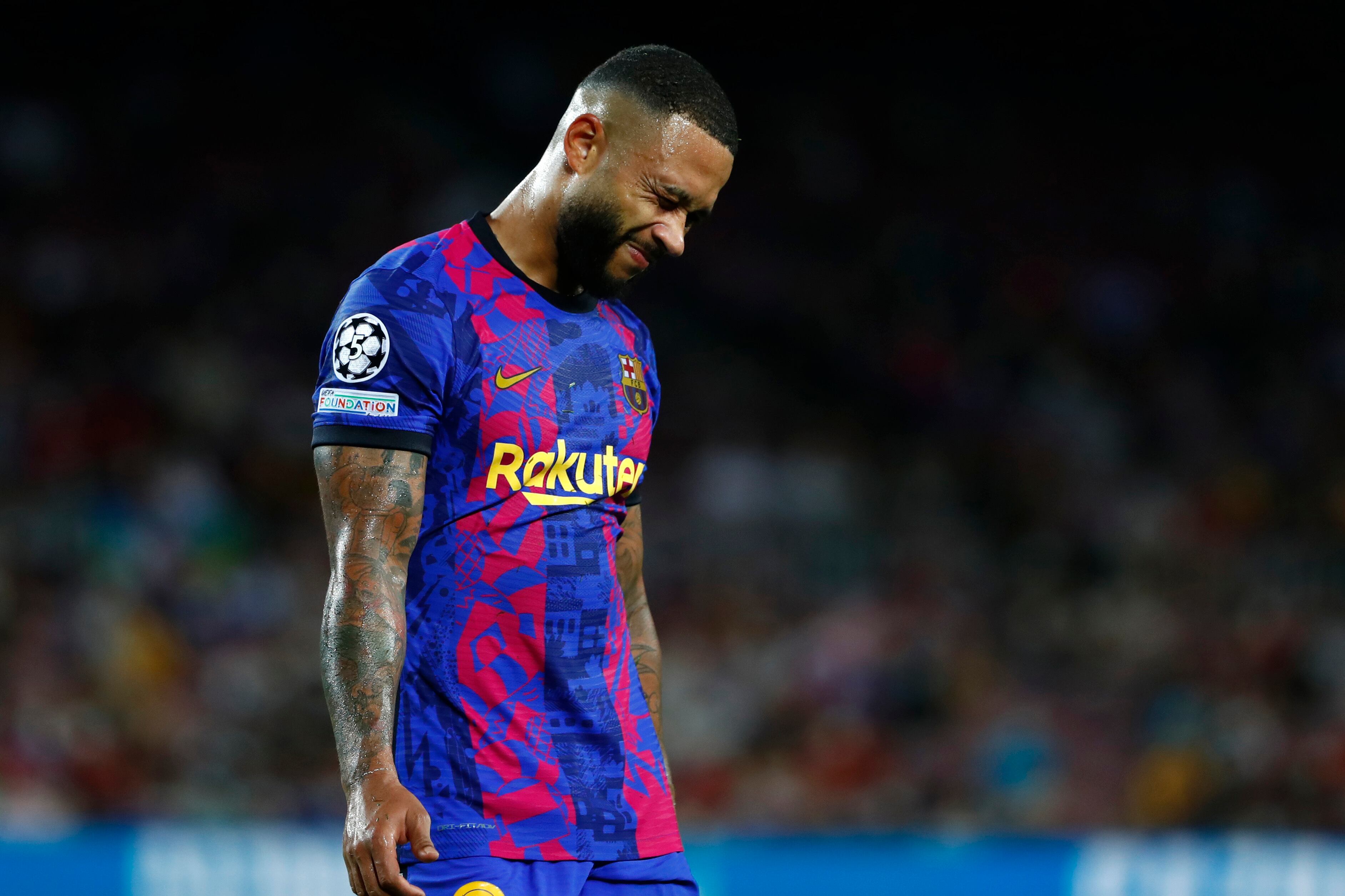 Barcelona's Memphis Depay reacts at the end of a Champions League group E soccer match between F.C. Barcelona and Bayern at Camp Nou stadium in Barcelona, Spain, Tuesday, Sept. 14, 2021. (AP Photo/Joan Monfort)