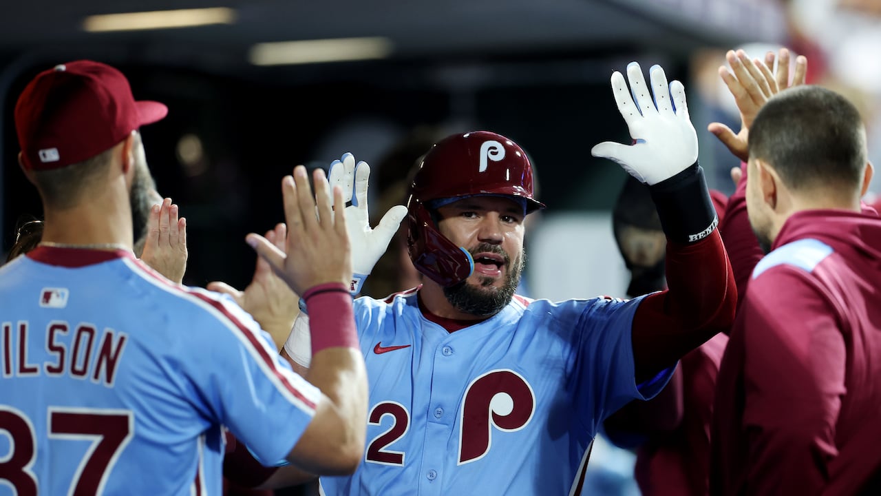 PHILADELPHIA, PENNSYLVANIA - AUGUST 28: Kyle Schwarber #12 of the Philadelphia Phillies celebrates in the dugout after hitting a two-run home run in the fourth inning against the Atlanta Braves at Citizens Bank Park on August 28, 2025 in Philadelphia, Pennsylvania. (Photo by Emilee Chinn/Getty Images)