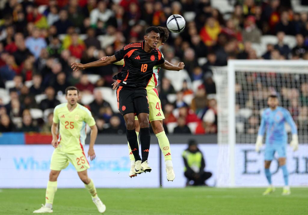 LONDON, ENGLAND - MARCH 22: Mateo Cassierra of Colombia and ﻿﻿Martin Zubimendi of Spain (hidden) compete for a header during the international friendly match between Spain and Colombia at London Stadium on March 22, 2024 in London, England. (Photo by Warren Little/Getty Images)