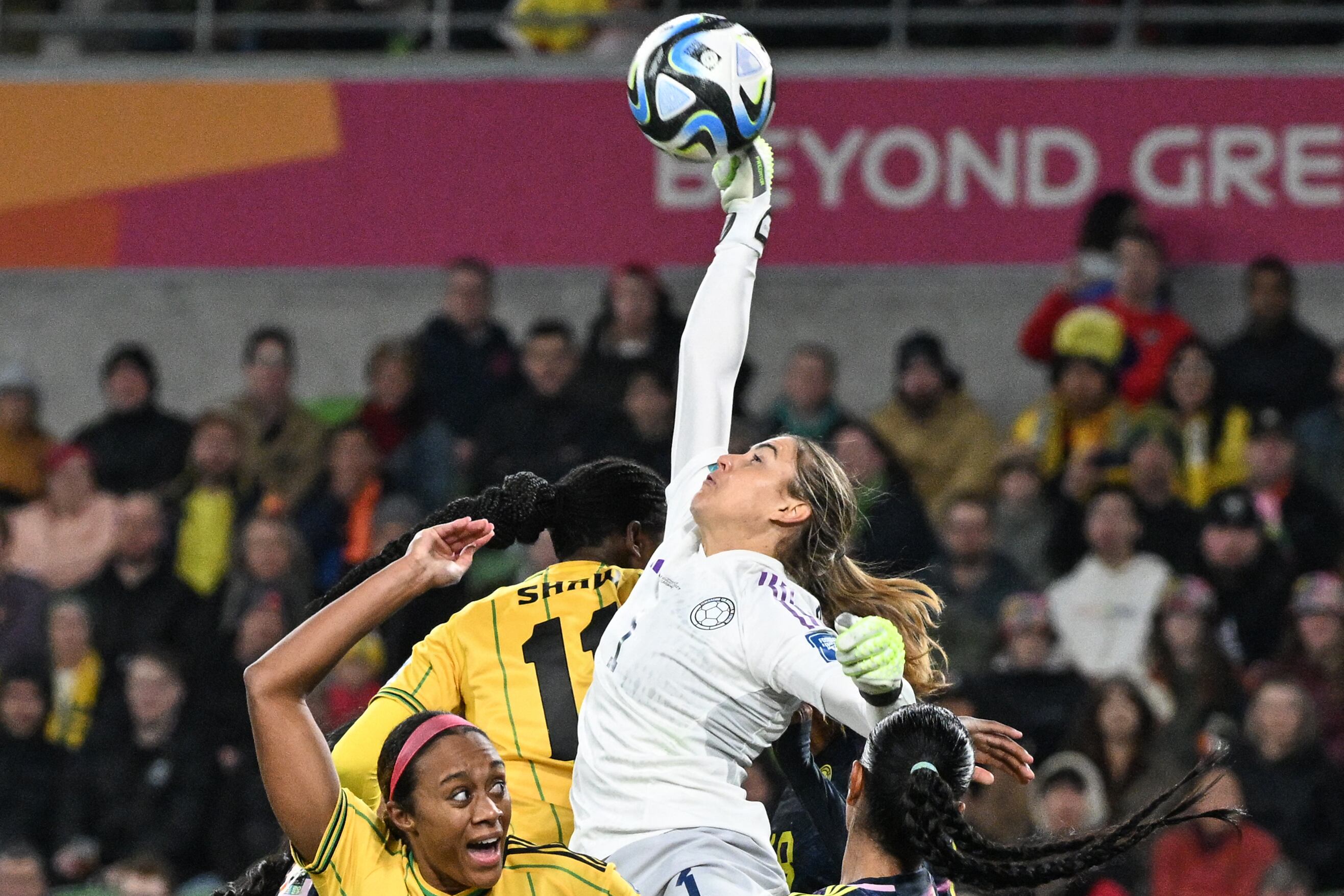 Colombia's goalkeeper #01 Catalina Perez (C) makes a save during the Australia and New Zealand 2023 Women's World Cup round of 16 football match between Jamaica and Colombia at Melbourne Rectangular Stadium, also known as AAMI Park, in Melbourne on August 8, 2023. (Photo by WILLIAM WEST / AFP)