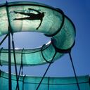 A person takes a ride on a curving water slide in Logan, Utah, USA.