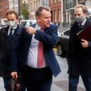 Britain's chief negotiator David Frost, center, removes his face mask to talk to the media as he arrives for Brexit talks with EU chief negotiator Michel Barnier in Brussels, Monday, Nov. 16, 2020. Britain and the EU say any post-Brexit trade deal must be agreed upon by mid-November so it can be ratified by the end of the year, but the negotiations remain stuck on key issues like fishing rights and competition rules. (AP Photo/Francisco Seco)