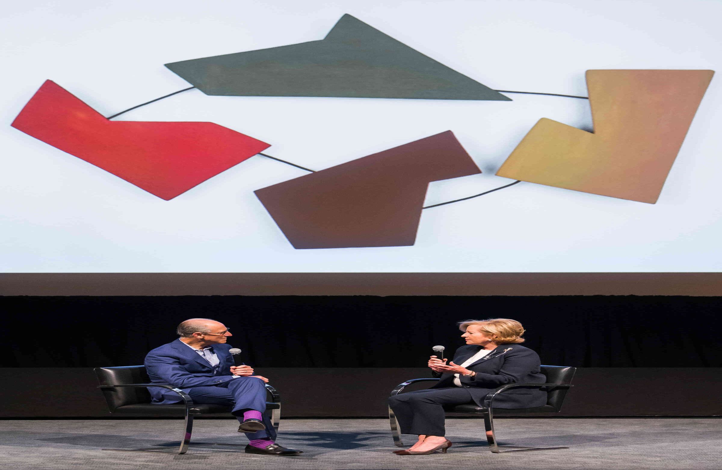 A. Glenn D. Lowry, Director, The Museum of Modern Art, and Patricia Phelps de Cisneros, in front of Raúl Lozza’s Relief N 30 (1946) at MoMA.