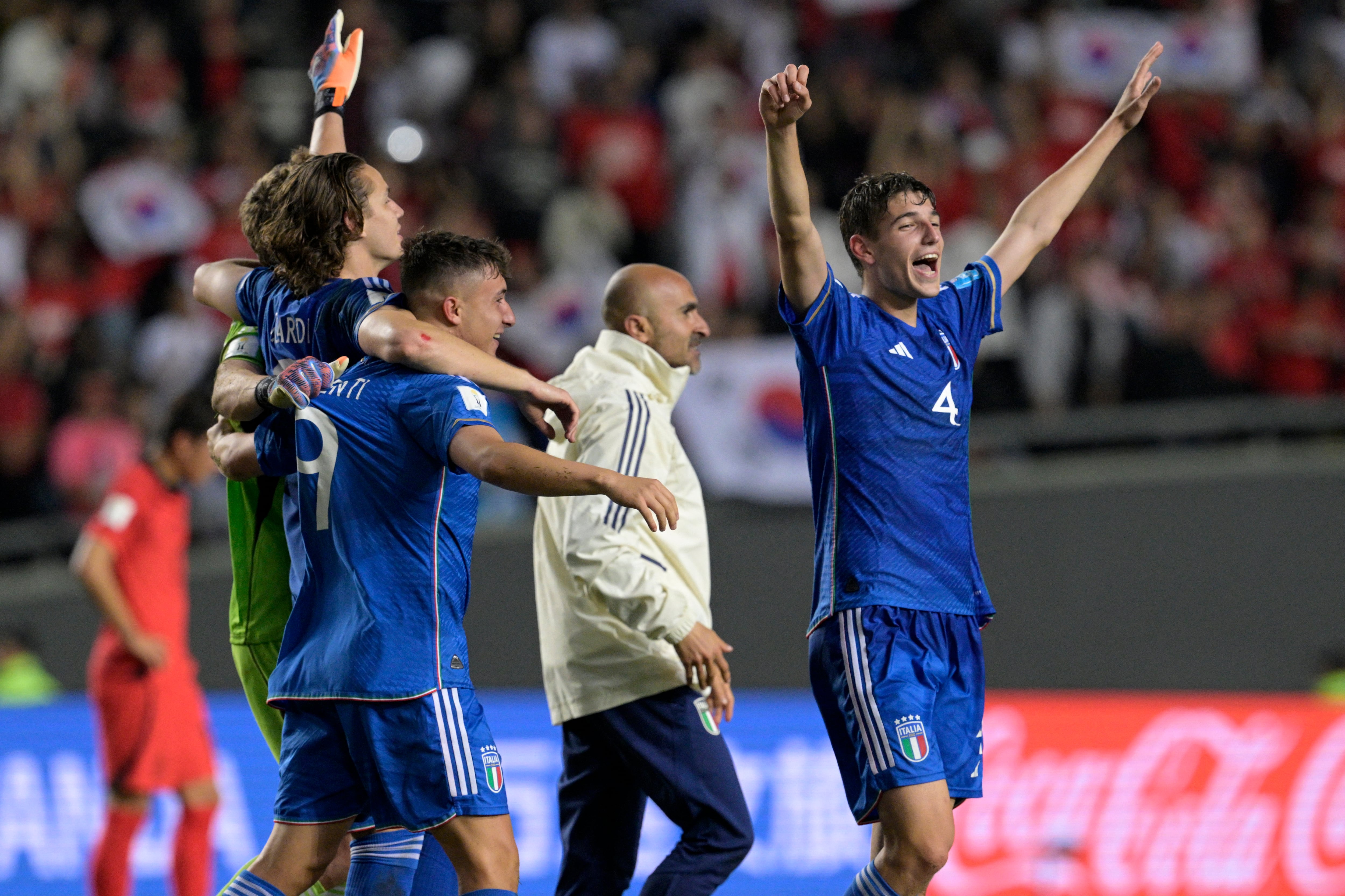Italian players celebrate after defeating South Korea in the Argentina 2023 U-20 World Cup semi-final match between Italy and South Korea at the Estadio Unico Diego Armando Maradona stadium in La Plata, Argentina, on June 8, 2023. Italy won 2-1 and will face Uruguay in the final. (Photo by JUAN MABROMATA / AFP)