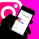 SPAIN - 2021/03/29: In this photo illustration, the Instagram app in App Store seen displayed on a smartphone screen and a Instagram logo in the background. (Photo Illustration by Thiago Prudencio/SOPA Images/LightRocket via Getty Images)