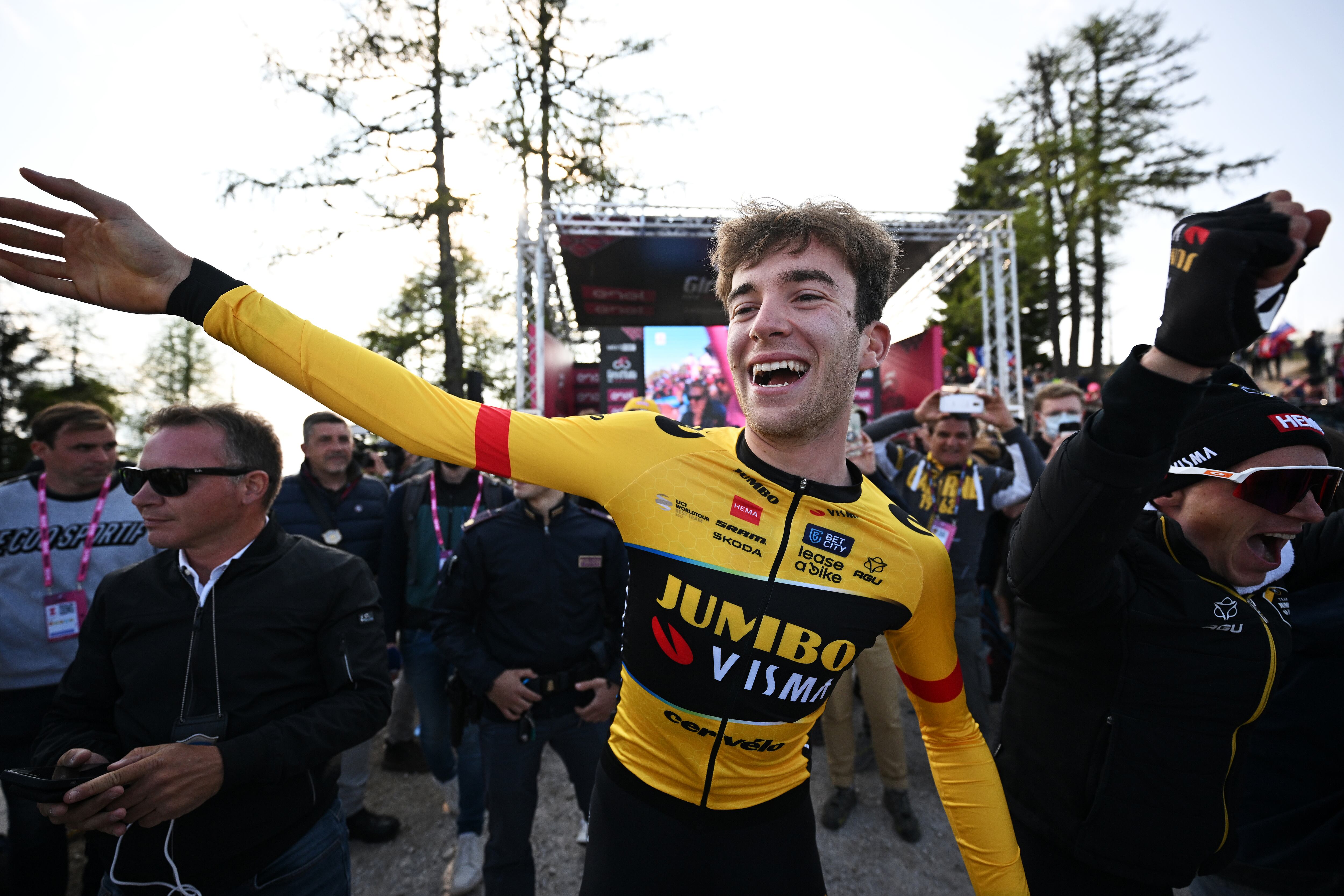 MONTE LUSSARI, ITALY - MAY 27: Michel Hessmann of Germany and Team Jumbo-Visma celebrates the victory of his teammate Primož Roglič during the 106th Giro d'Italia 2023, Stage 20 a 18.6km individual climbing time trial stage from Tarvisio 750m to Monte Lussari 1744m / #UCIWT / on May 27, 2023 in Monte Lussari, Italy. (Photo by Stuart Franklin/Getty Images,)