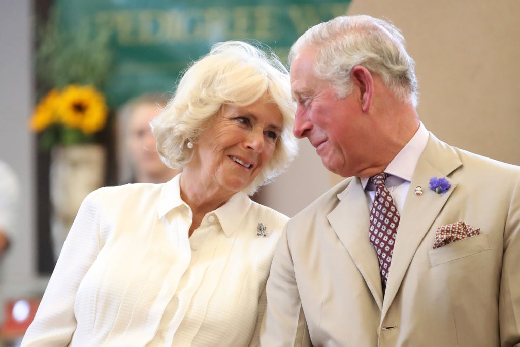 BUILTH WELLS, WALES - JULY 04:  Prince Charles, Prince of Wales and Camilla, Duchess of Cornwall look at eachother as they reopen the newly-renovated Edwardian community hall The Strand Hall during day three of a visit to Wales on July 4, 2018 in Builth Wells, Wales.  (Photo by Chris Jackson/Getty Images)