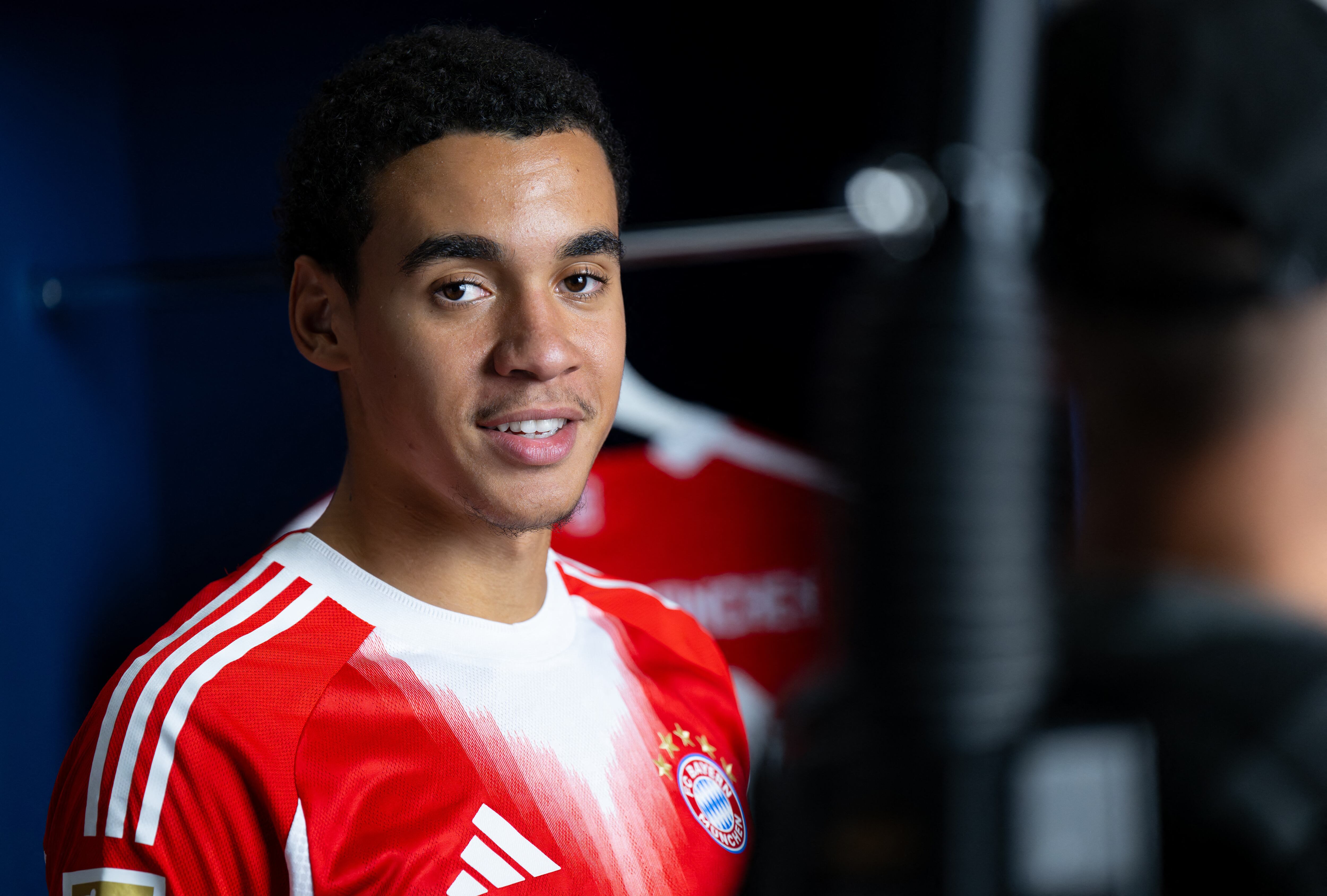 19 August 2025, Bavaria, Munich: Soccer: Bundesliga, Paulaner Lederhosen shoot at FC Bayern. Jamal Musiala takes part in the Paulaner Lederhosen shoot at FC Bayern Munich. Photo: Sven Hoppe/dpa - IMPORTANT NOTE: In accordance with the regulations of the DFL German Football League and the DFB German Football Association, it is prohibited to utilize or have utilized photographs taken in the stadium and/or of the match in the form of sequential images and/or video-like photo series. (Photo by SVEN HOPPE / dpa Picture-Alliance via AFP)