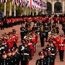 Military personnel parade as the coffin of Queen Elizabeth II is carried following her funeral service in Westminster Abbey in central London, Monday, Sept. 19, 2022. The Queen, who died aged 96 on Sept. 8, will be buried at Windsor alongside her late husband, Prince Philip, who died last year. (AP Photo/Vadim Ghirda, Pool)