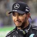 FILE- Mercedes driver Lewis Hamilton, of Britain smiles, after winning the pole position during qualifying for the Formula One Saudi Arabian Grand Prix auto race on Dec. 4, 2021, in Jiddah, Saudi Arabia. Hamilton returned to social media Saturday, Feb. 5, 2022, following a lengthy silence that dates to last season's controversial Formula 1 finale. (Giuseppe Cacace/Pool Photo via AP, File)