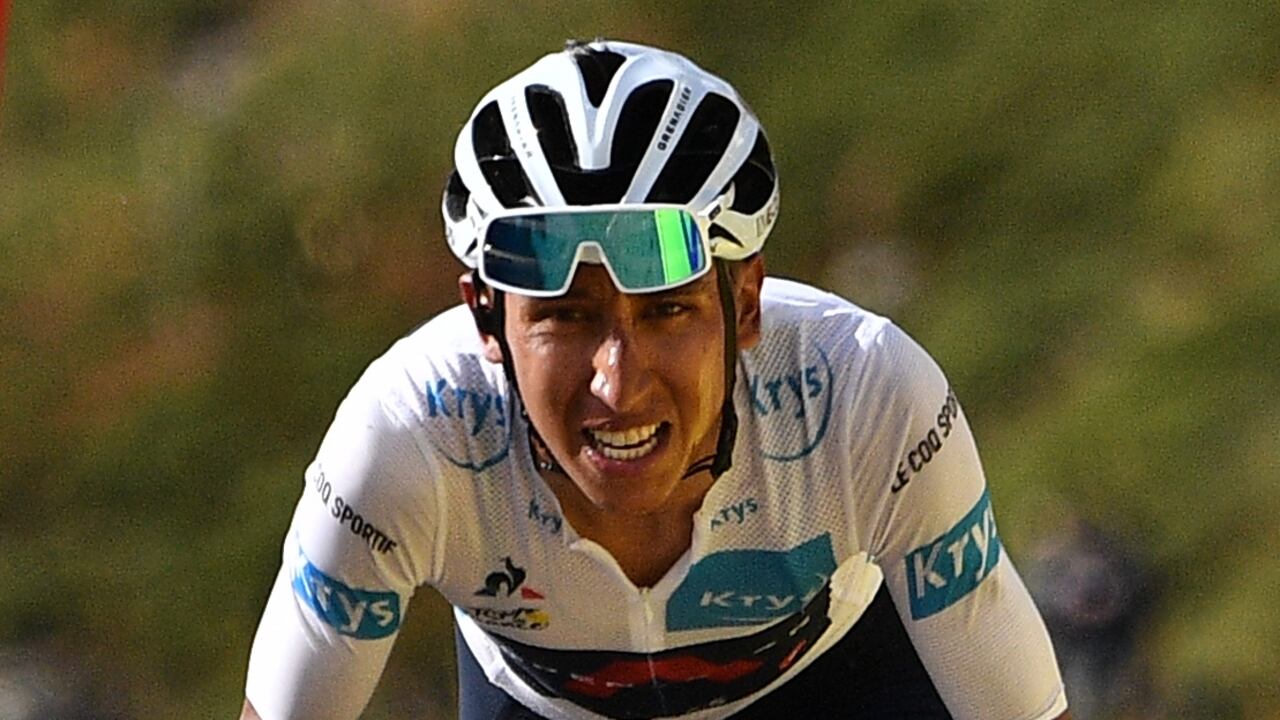 Team Ineos rider Colombia's Egan Bernal wearing the best young's white jersey arrives at the finish line of the 13th stage of the 107th edition of the Tour de France cycling race, 191 km between Chatel-Guyon and Puy Mary, on September 11, 2020. (Photo by Anne-Christine POUJOULAT / various sources / AFP)