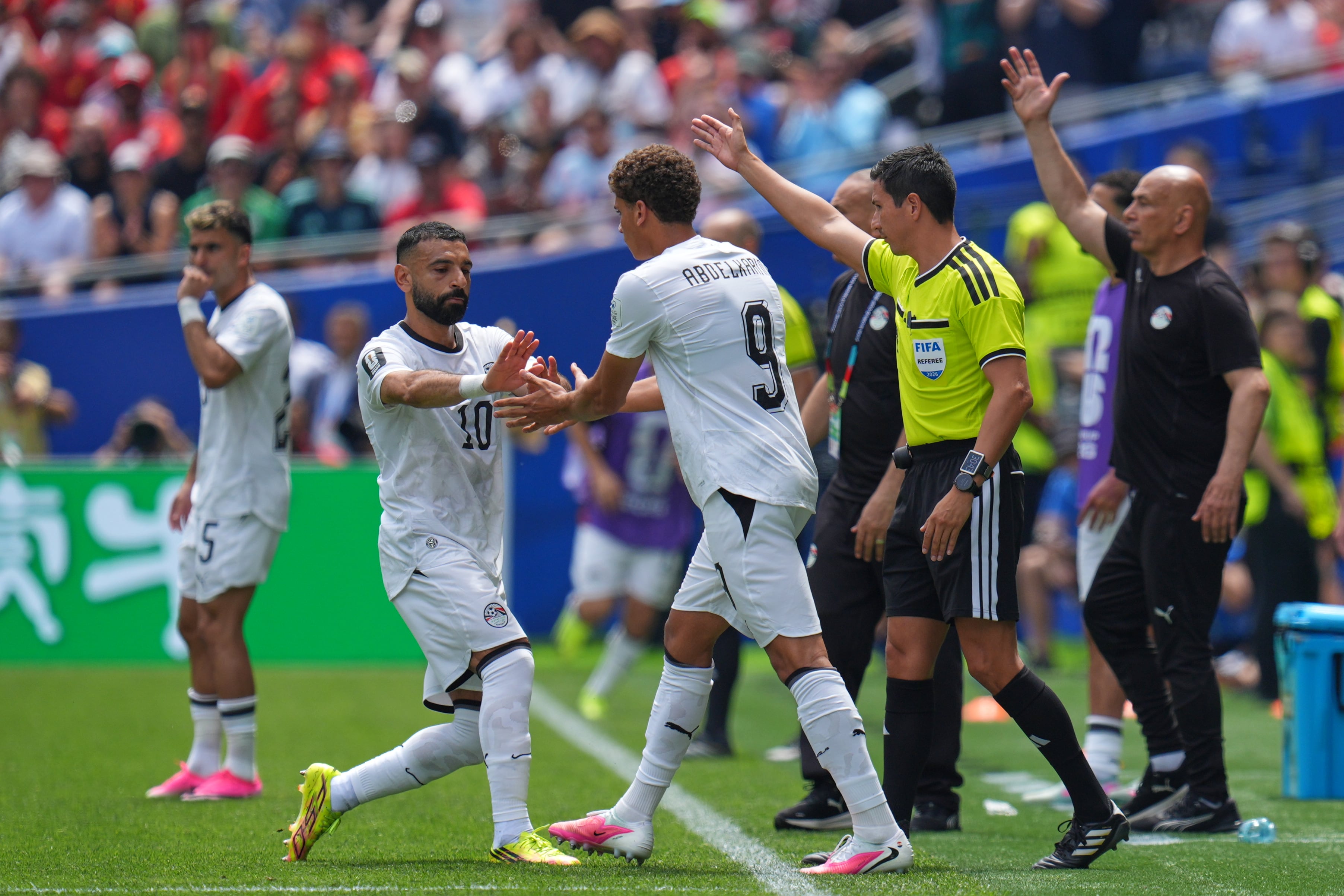 Egypt's Mohamed Salah, left is substituted and replaced by Egypt's Hamza Abdelkarim during the World Cup Group G soccer match between Belgium and Egypt in Seattle, Monday, June 15, 2026. (AP Photo/Manu Fernandez)
