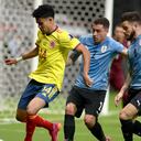BRASILIA, BRAZIL - JULY 03: Luis Diaz of Colombia competes for the ball with Jose Gimenez (C) and Nahitan Nandez (R) of Uruguay during the Quarterfinal match between Uruguay and Colombia as part of Conmebol Copa America Brazil 2021 at Mane Garrincha Stadium on July 3, 2021 in Brasilia, Brazil. (Photo by MB Media/Getty Images)