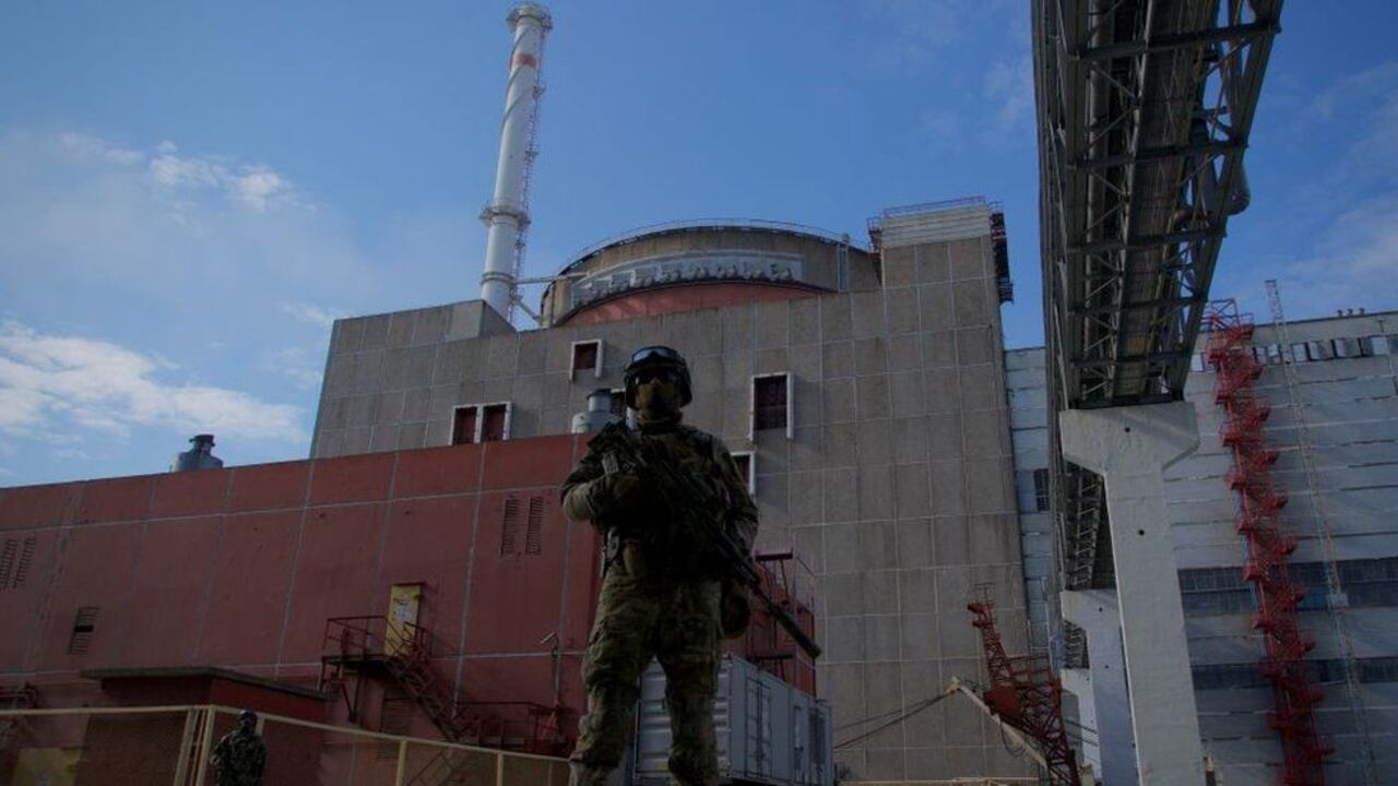 A Russian soldier stands guard outside Zaporizhzhia nuclear power plant