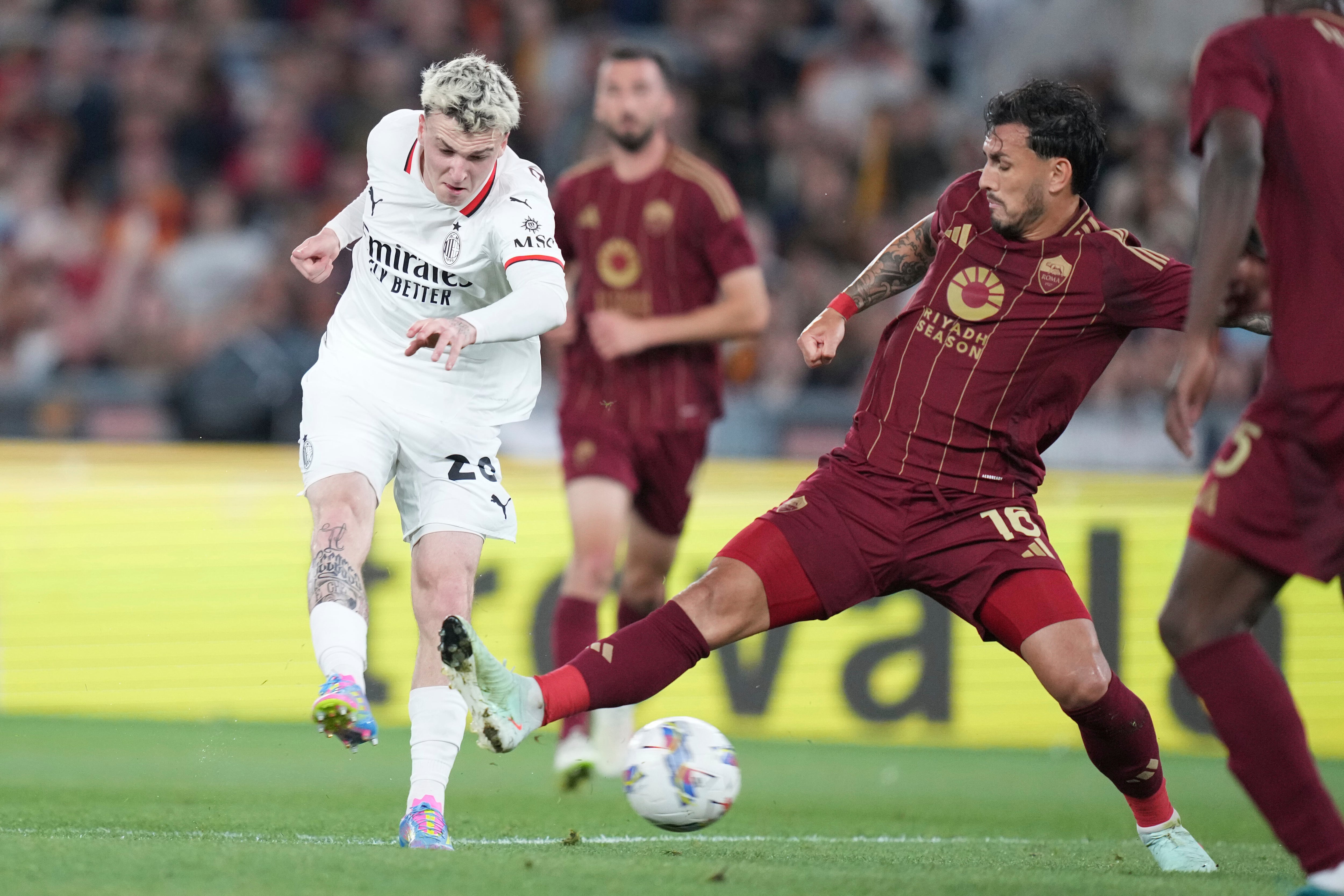 AC Milan's Alex Jimenez, left, and Roma's Leandro Paredes in action during the Italian Serie A soccer match between Roma and Milan at the Rome's Olympic stadium, Italy, Sunday, May 18, 2025. (Alfredo Falcone/LaPresse via AP)
