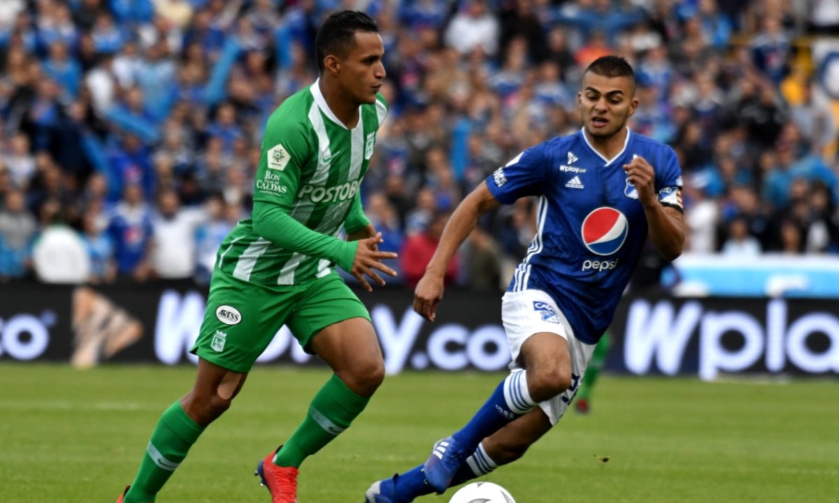 BOGOTA, COLOMBIA - MARCH 09: Jhon Duque of Millonarios vies for the ball with Brayan Rovira of Atletico Nacional during a match between Millonarios and Atlético Nacional as part of Liga Aguila 2019 at Estadio Nemesio Camacho on March 09, 2019 in Bogota, Colombia. (Photo by Getty Images/Luis Ramirez/Vizzor Image)