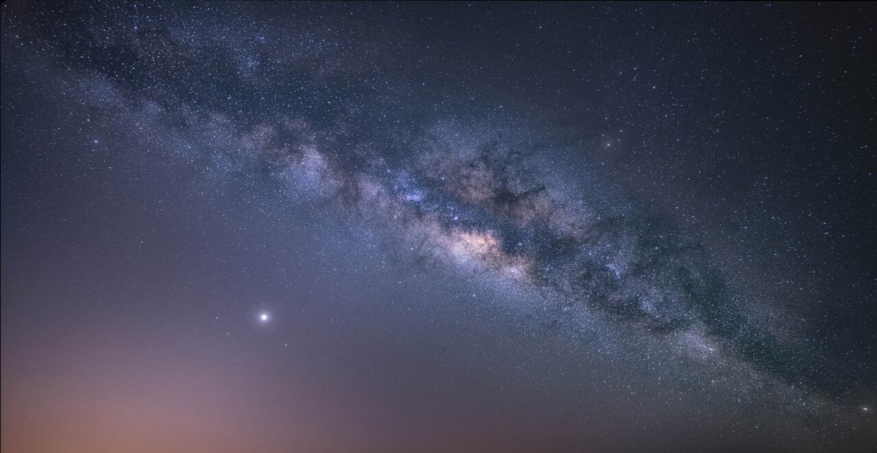 view universe space shot of milky way galaxy with stars on a night sky background.The Milky Way is the galaxy that contains our Solar System.