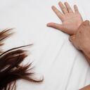 A hairy man's hand holding a woman hand for rape and sexual abuse concept