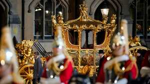 FILE - The Gold State Coach is led in a procession as it leaves Westminster Abbey in central London, early Wednesday, May 3, 2023 during a rehearsal for the Coronation of King Charles III which will take place at Westminster Abbey on May 6 Britain’s royal family turns the page on a new chapter with the coronation of King Charles III on Saturday. Charles ascended the throne when his mother, Queen Elizabeth II, died last year. (AP Photo/Andreea Alexandru, File)