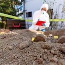 War crime investigation. Forensic science specialist at work.