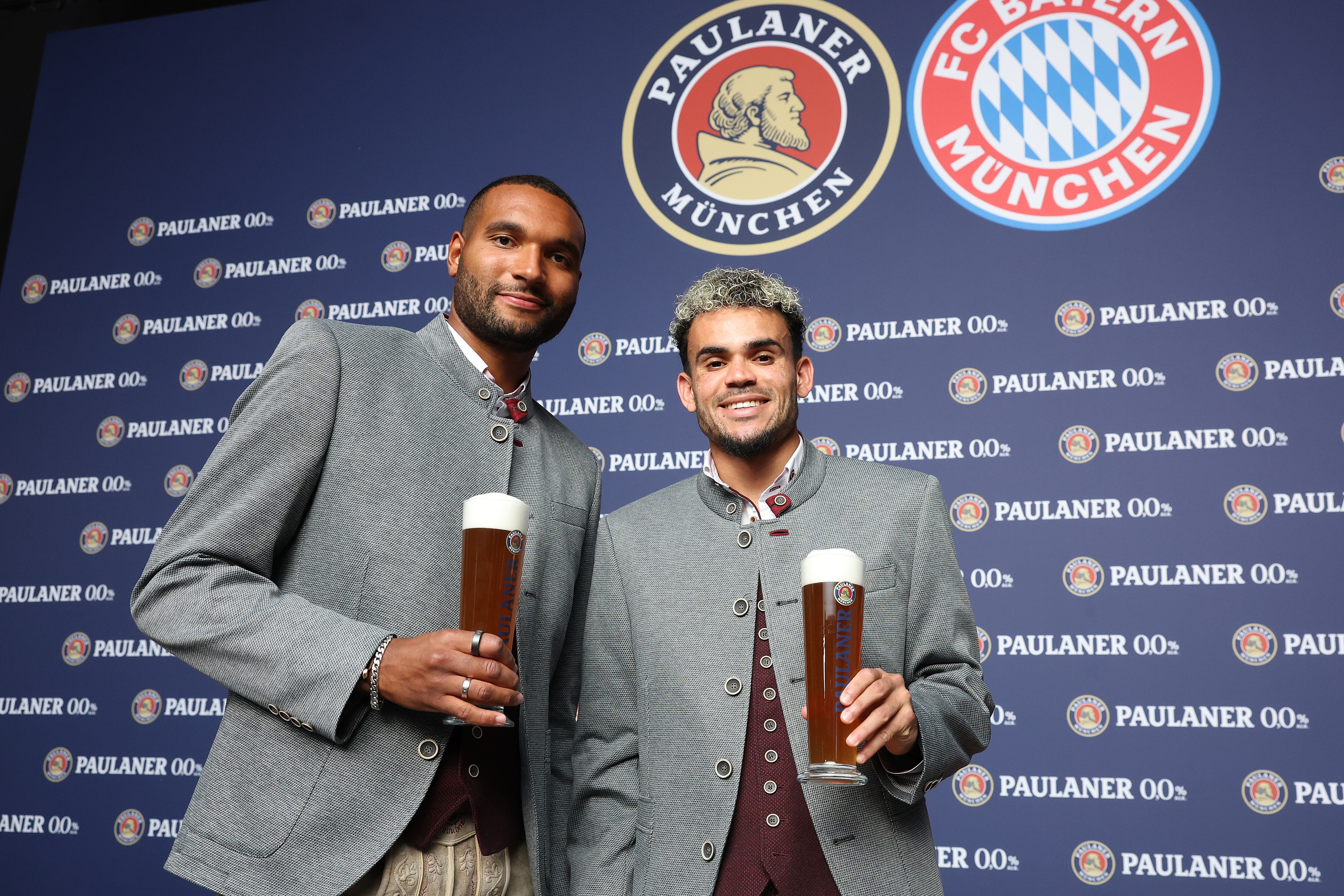 MUNICH, GERMANY - AUGUST 19: Jonathan Tah (L) of FC Bayern München attends with Luis Diaz the FC Bayern München and Paulaner Photo Session at Bavaria Filmsstudios on August 19, 2025 in Munich, Germany. (Photo by Alexander Hassenstein/Getty Images for Paulaner)