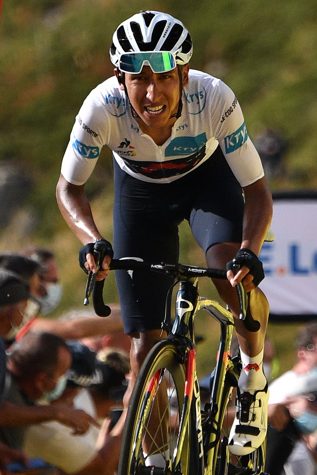 Team Ineos rider Colombia's Egan Bernal wearing the best young's white jersey arrives at the finish line of the 13th stage of the 107th edition of the Tour de France cycling race, 191 km between Chatel-Guyon and Puy Mary, on September 11, 2020. (Photo by Anne-Christine POUJOULAT / various sources / AFP)