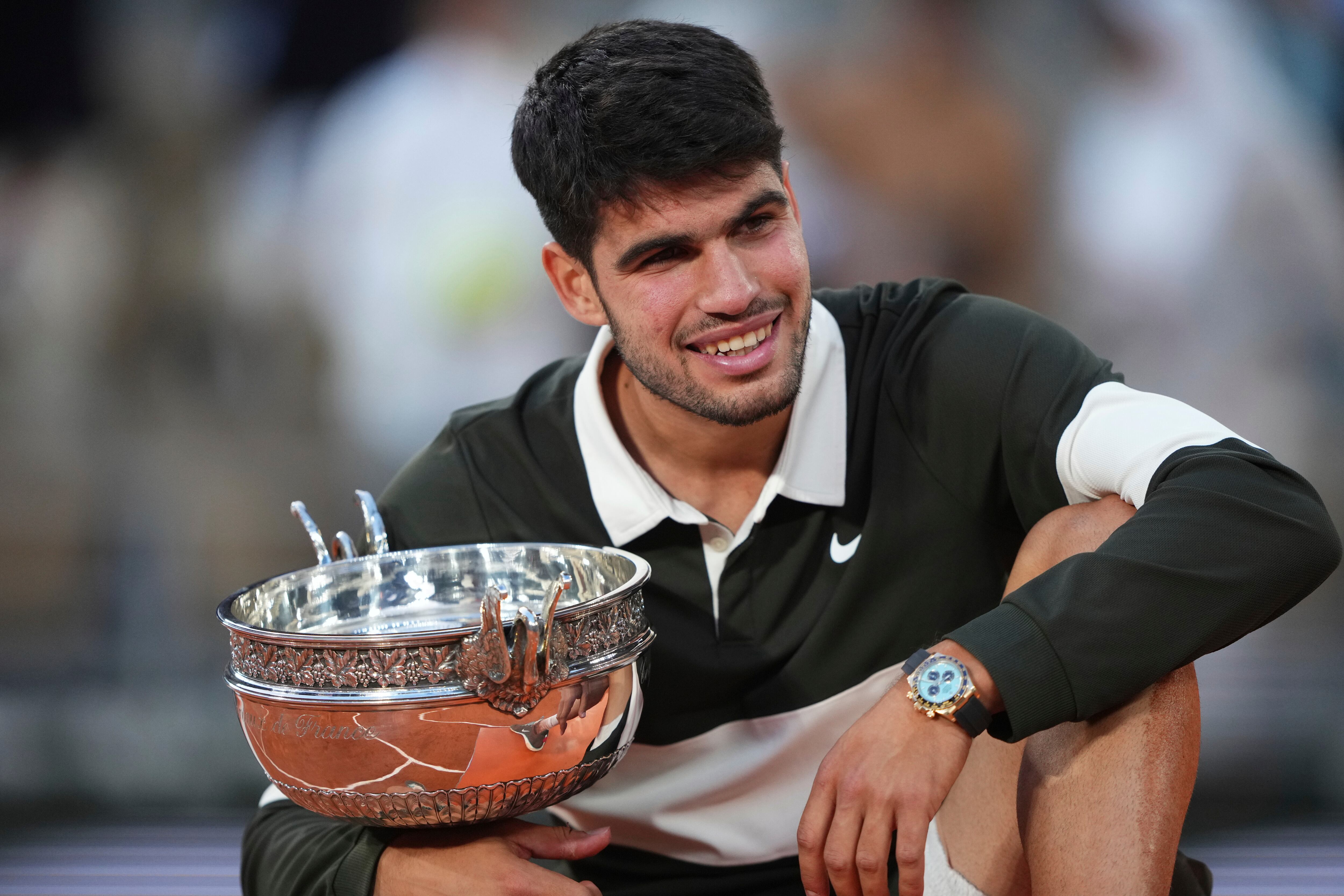 Spain's Carlos Alcaraz celebrates with the trophy after winning the final match of the French Tennis Open against Italy's Jannik Sinner at the Roland-Garros stadium in Paris, Sunday, June 8, 2025. (AP Photo/Lindsey Wasson)