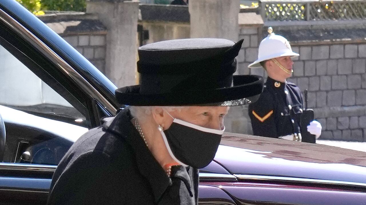 Queen Elizabeth II arrives for the funeral service of Britain's Prince Philip, Duke of Edinburgh inside St George's Chapel in Windsor Castle in Windsor, west of London, on April 17, 2021. - Philip, who was married to Queen Elizabeth II for 73 years, died on April 9 aged 99 just weeks after a month-long stay in hospital for treatment to a heart condition and an infection. (Photo by Jonathan Brady / POOL / AFP)