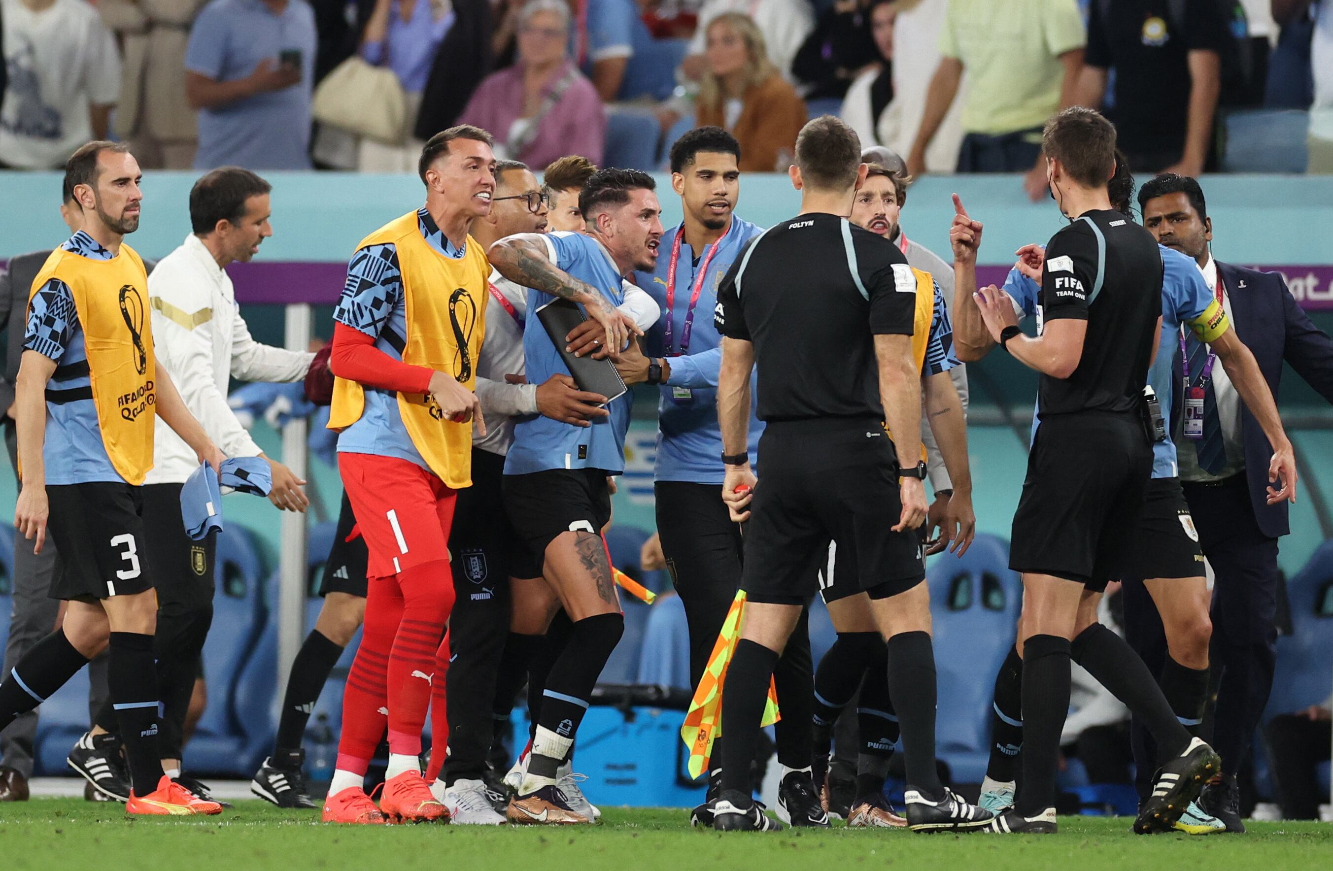 Soccer Football - FIFA World Cup Qatar 2022 - Group H - Ghana v Uruguay - Al Janoub Stadium, Al Wakrah, Qatar - December 2, 2022 Uruguay players remonstrate with referee Daniel Siebert after the match REUTERS/Amr Abdallah Dalsh
