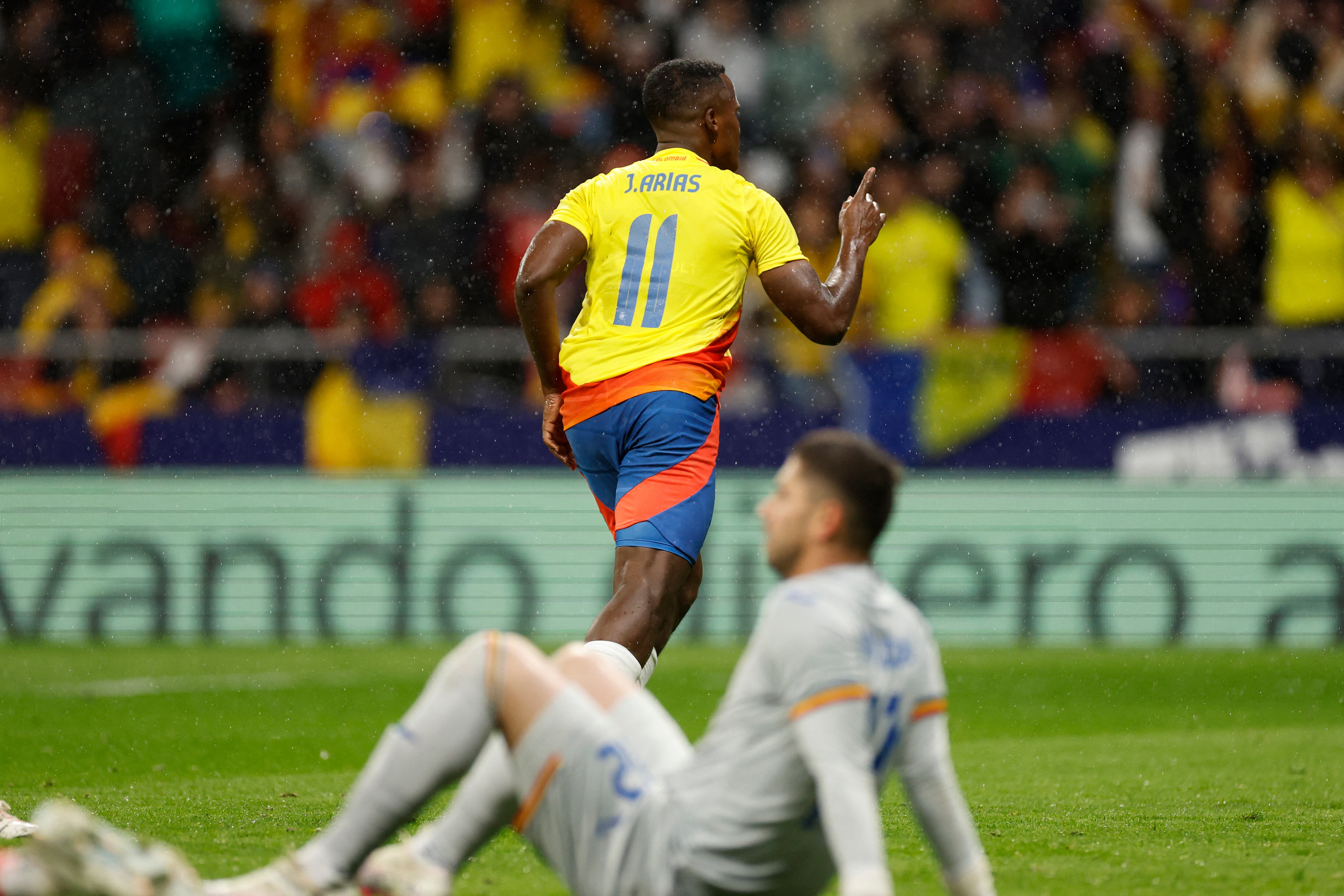 Colombia's midfielder #11 Jhon Arias (up) celebrates scoring his team's second goal during the international friendly football match between Romania and Colombia at the Metropolitano stadium in Madrid on March 26, 2024. (Photo by OSCAR DEL POZO / AFP)
