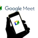 SPAIN - 2021/04/20: In this photo illustration a Google Meet app in seen displayed on a smartphone with the Google Meet logo in the background. (Photo Illustration by Thiago Prudencio/SOPA Images/LightRocket via Getty Images)
