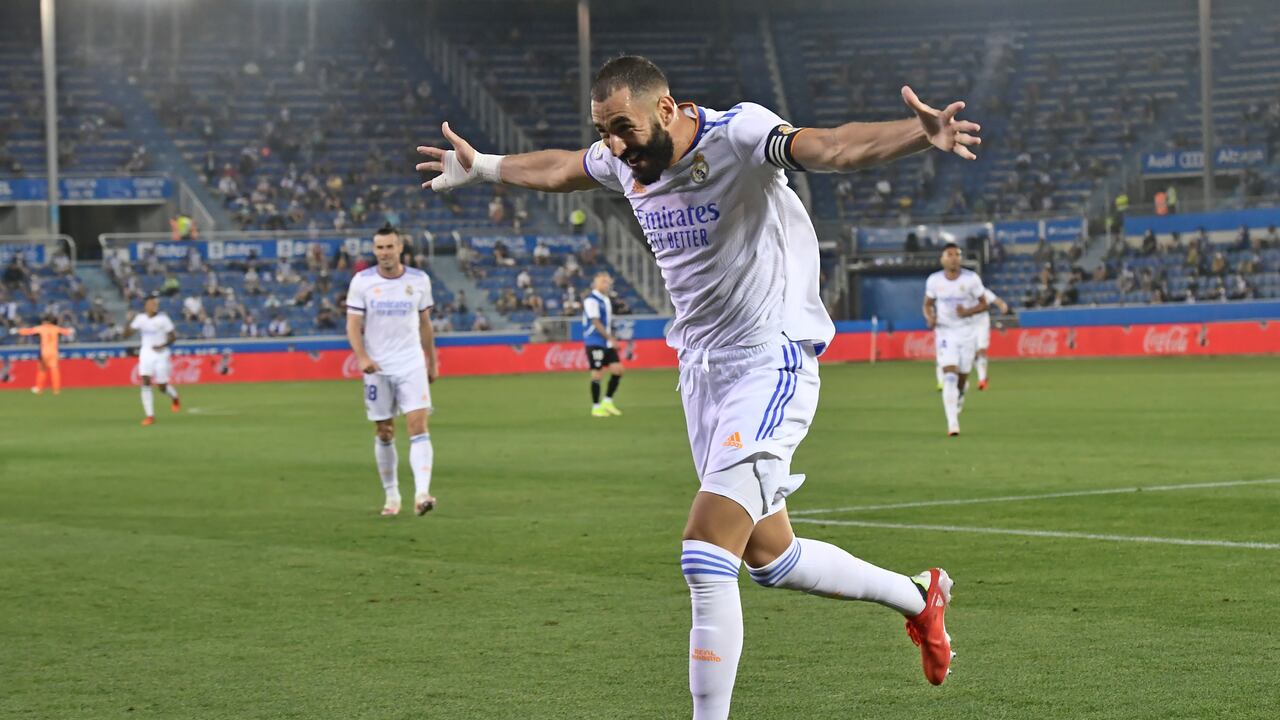 Real Madrid's Karim Benzema celebrates after scoring his side's third goal during a Spanish La Liga soccer match between Alaves and Real Madrid at the Mendizorroza stadium in Vitoria, Spain, Saturday, Aug. 14, 2021. (AP Photo/Alvaro Barrientos)
