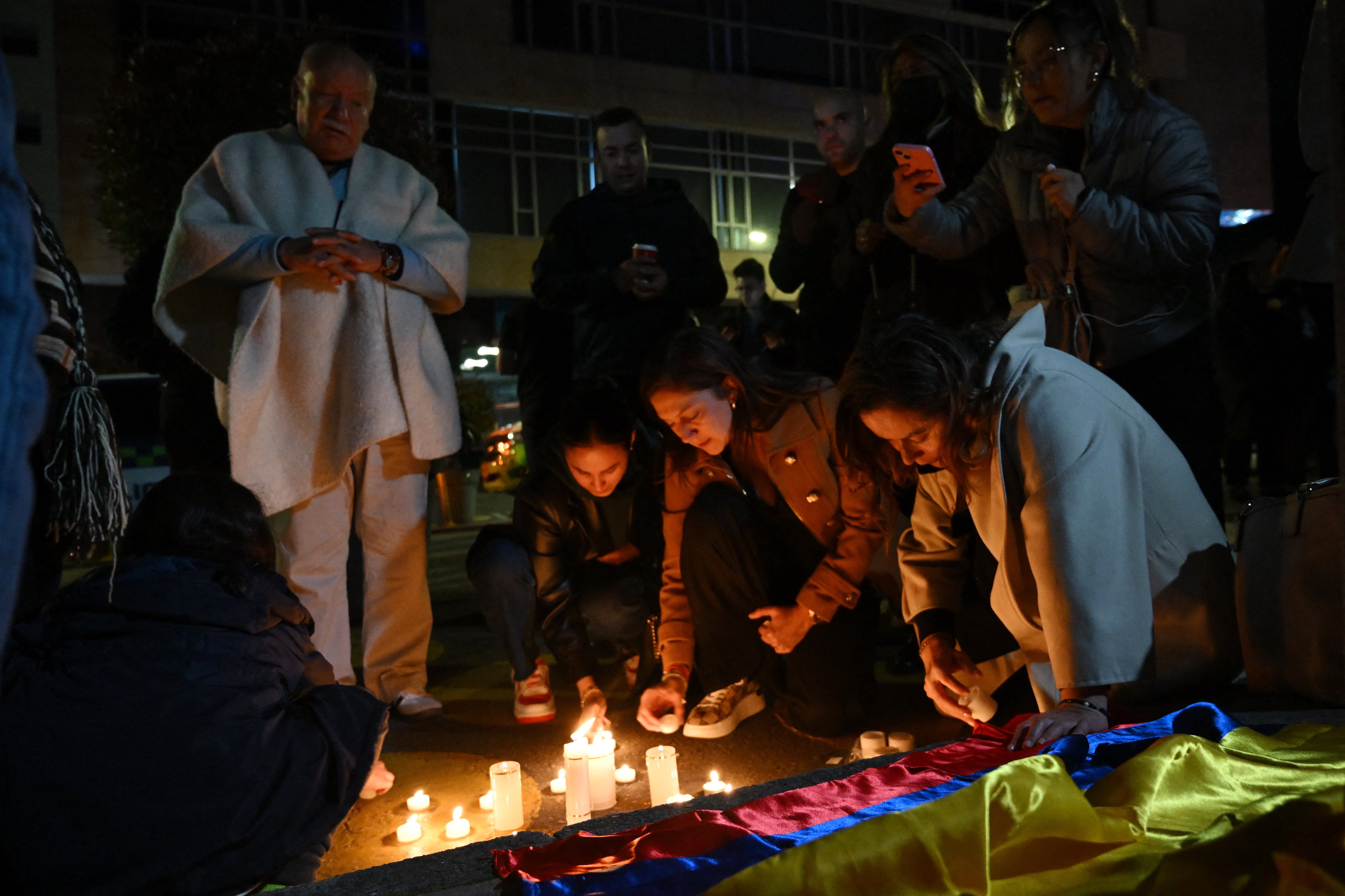 Forensic experts work at the crime scene where Senator Miguel Uribe was shot and wounded in the Modelia neighborhood in Bogota on June 7, 2025. A Colombian right-wing opposition senator and candidate for next year's presidential election, Miguel Uribe, 39, was shot and wounded in Bogota on June 7, 2025, various media reported, while the government denounced an "attack." (Photo by RAUL ARBOLEDA / AFP)