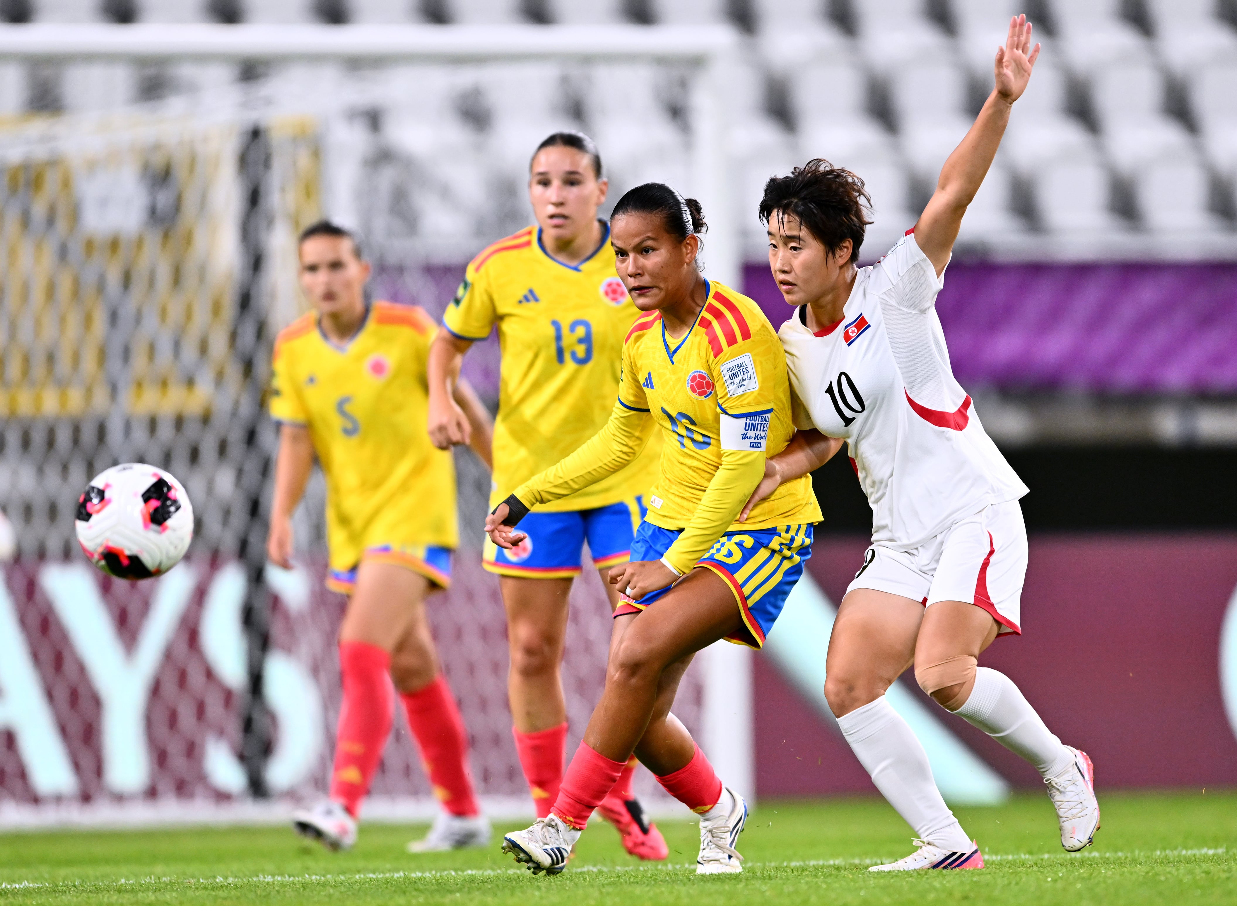 LODZ, POLAND - SEPTEMBER 13: Juana Ortegon of Colombia passes the ball whilst under pressure from Yon A Choe of DPR Korea during the FIFA U-20 Women's World Cup Group Stage match between Colombia and Korea DPR at Stadion Miejski on September 13, 2026 in Lodz, Poland. (Photo by Mateusz Slodkowski - FIFA/FIFA via Getty Images)